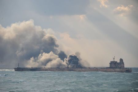 Smoke is seen from the Panama-registered Sanchi tanker carrying Iranian oil, which went ablaze after a collision with a Chinese freight ship in the East China Sea, in this January 9, 2018 handout picture released by China's Ministry of Transport January 10, 2018. China's Ministry of Transport/Handout via REUTERS