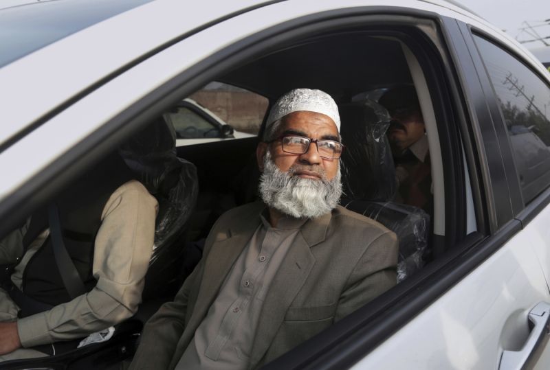 Mohammed Amin, father of seven year-old girl Zainab Ansari, leaves following the court verdict, in Lahore, Pakistan, Saturday, Feb. 17, 2018. A public prosecutor in Pakistan says a court has sentenced a serial killer to death after finding him guilty of killing eight children, including a 7-year-old girl whose rape and murder drew nationwide condemnation. (AP Photo/K.M. Chaudary)