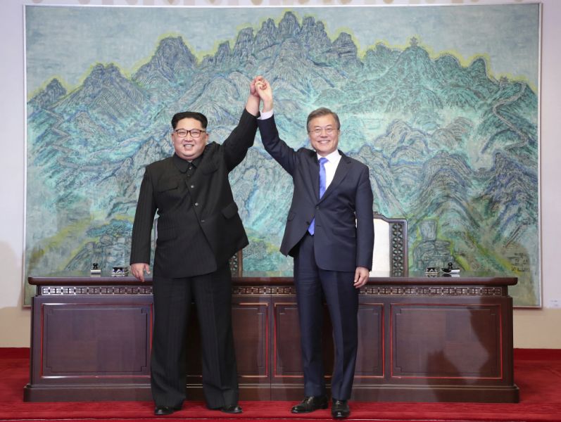 FILE - In this Friday, April 27 file photo, North Korean leader Kim Jong Un, left, and South Korean President Moon Jae-in raise their hands after signing on a joint statement at the border village of Panmunjom in the Demilitarised Zone, South Korea. North Korea's Foreign Ministry said Saturday May 12, 2018, it will hold a 