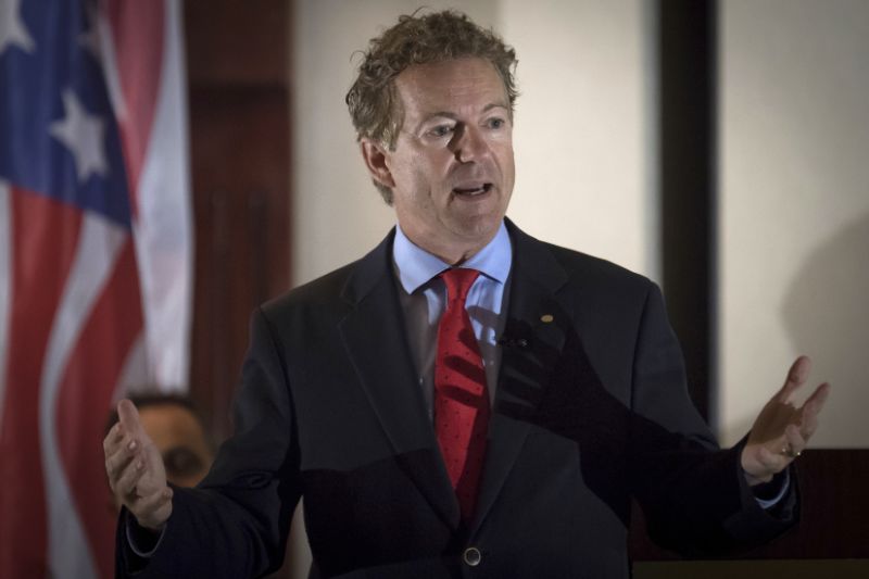 In this Aug. 11, 2017 photo, Sen. Rand Paul, R-Ky., speaks to supporters in Hebron, Ky. A man has been arrested and charged with assaulting and injuring Rand Paul. Kentucky State Police said in a news release Saturday, Nov. 4, 2017 that Paul suffered injuries when 59-year-old Rene Boucher assaulted him at his Warren County home on Friday afternoon. The release did not provide details of the assault or the nature of Paul's injury. In a statement, Paul spokeswoman Kelsey Cooper said the Republican senator was 