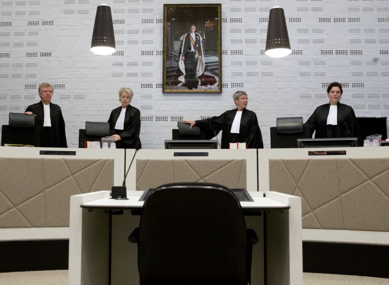 Presiding Judge Renckens, center, opens the court session in The Hague, Netherlands, Monday, Oct. 30, 2017, in the case against a Dutch national of Ethiopian descent for alleged war crimes committed during the 1970's regime in Ethiopia. (AP Photo/Peter Dejong)