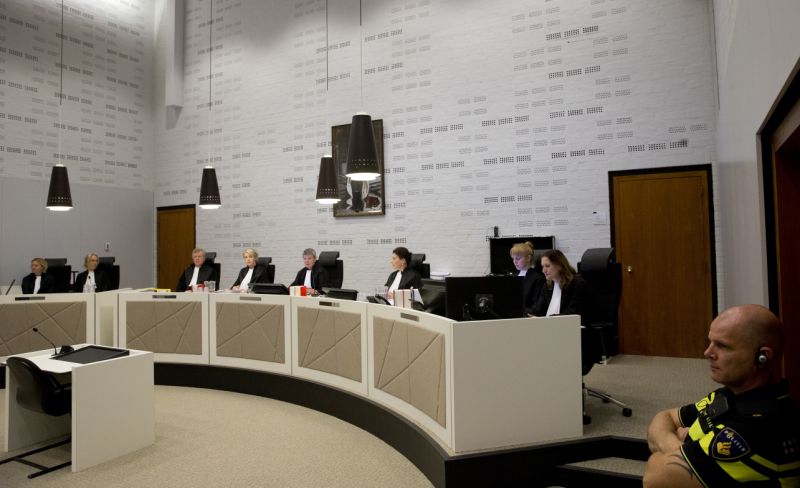 Presiding Judge Renckens, center, opens the court session in The Hague, Netherlands, Monday, Oct. 30, 2017, in the case against a Dutch national of Ethiopian descent for alleged war crimes committed during the 1970's regime in Ethiopia. (AP Photo/Peter Dejong)