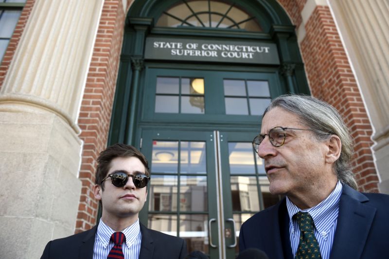 Lucian Wintrich, left, White House correspondent for the right-wing blog Gateway Pundit, takes questions from the media with his attorney Norman Pattis, right, outside Rockville Superior Court in Vernon, Conn., Monday, Dec. 11, 2017. Charges of breach of peace against Wintrich were dropped stemming from a Nov 28 incident at the University of Connecticut at which Wintrich delivered a speech titled