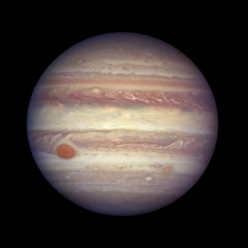 FILE - This April 3, 2017 image made available by NASA shows the planet Jupiter.   A team of astronomers is reporting the recent discovery of a dozen new moons circling the giant gas planet. That brings the number of moons at Jupiter to 79, the most of any planet.  The astronomers were looking for objects on the fringes of the solar system when they spotted the Jupiter moons. They found a dozen small moons. The confirmation of 10 was announced Tuesday, July 17, 2018; two were confirmed earlier. They’re calling one moon an ‘oddball’ because of its unusual orbit. (NASA, ESA, and A. Simon (GSFC) via AP, File)
