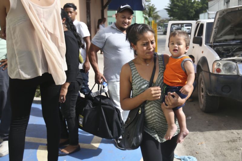 Adalicia Montecino holds her year-old son Johan Bueso Montecinos, who became a poster child for the U.S. policy of separating immigrants and their children, as they leave the Casa Belen Shelter, in San Pedro Sula, Honduras, Friday, 20, 2018. Johan Bueso Montecinos arrived in San Pedro Sula and was reunited with his parents on a government bus. Captured by Border Patrol agents in March, Johan’s father was deported and the then 10-month-old remained at an Arizona shelter. (AP Photo/Esteban Felix)