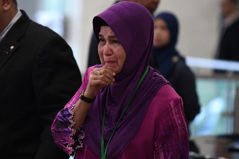 Sarah Nor, the mother of a passenger on MH370, weeps as she arrives for the final investigation report (AFP Photo/Mohd RASFAN)