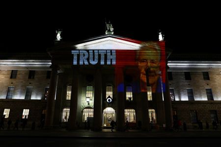 Projections showing victims of clerical abused are seen on the General Post Office (GPO) as part of a protest, ahead of a visit by Pope Francis, in Dublin, Ireland August 24, 2018.  REUTERS/Hannah McKay