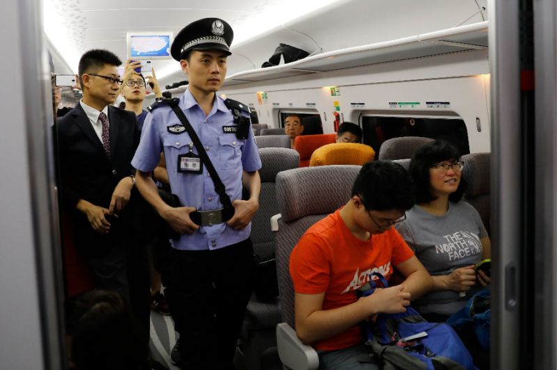 Passengers had to switch to a registered Chinese mobile number or WeChat account to access WiFi once they crossed into the mainland (AFP Photo/TYRONE SIU)