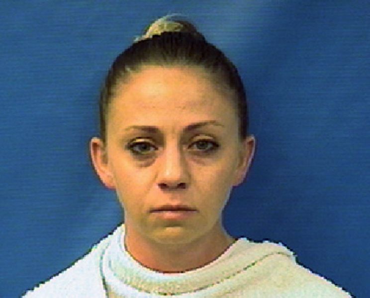 FILE - This file photo provided by the Kaufman County Sheriff's Office shows Amber Guyger. The former Dallas police officer has been indicted on a murder charge in the killing of her black unarmed neighbor in his own apartment, a residence she says she mistook for her own. The grand jury indictment of Guyger was announced Friday, Nov. 30, 2018. Guyger was arrested days after the Sept. 6 shooting that killed her 26-year-old neighbor Botham Jean, who was from the Caribbean island nation of St. Lucia. (Kaufman County (Texas) Sheriff's Office via AP, File)
