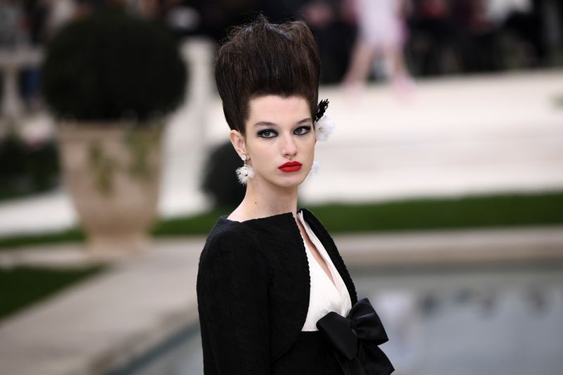 Vertical hair and grungy eyeshadow at Chanel