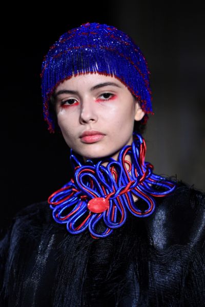 Glossy lips and red eyeshadow at Giorgio Armani