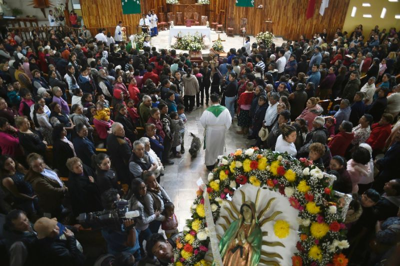 Relatives of three of the people killed in a massive blaze triggered by a leaky pipeline in Tlahuelilpan, Mexico attend their funeral on January 20, 2019