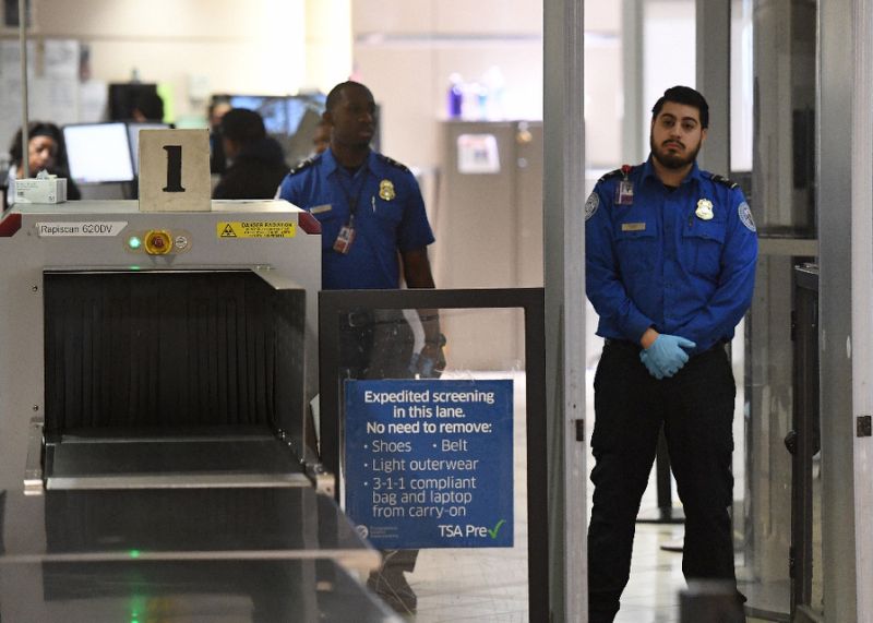 Transportation Security Administration officers (TSA) stand on duty at the departure area of the Los Angeles International Airport in Los Angeles (AFP Photo/Mark RALSTON)