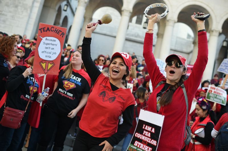 Striking teachers cheered as the teacher's union reached a tentative deal with the Los Angeles Unified School District (AFP Photo/Robyn BECK                         )