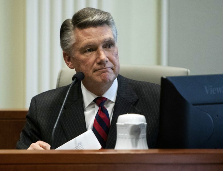 FILE - In this Thursday, Feb. 21, 2019, file photo, Mark Harris, Republican candidate in North Carolina's 9th congressional race, makes a statement before the state board of elections calling for a new election during the fourth day of a public evidentiary hearing on the 9th congressional district voting irregularities investigation at the North Carolina State Bar in Raleigh, N.C. Harris, whose narrow lead in the North Carolina congressional race was thrown out because of suspicions of ballot fraud, announced Tuesday, Feb. 26, 2019, he will not run in the newly ordered do-over election, saying he needs surgery in late March. (Travis Long/The News & Observer via AP, Pool, File)