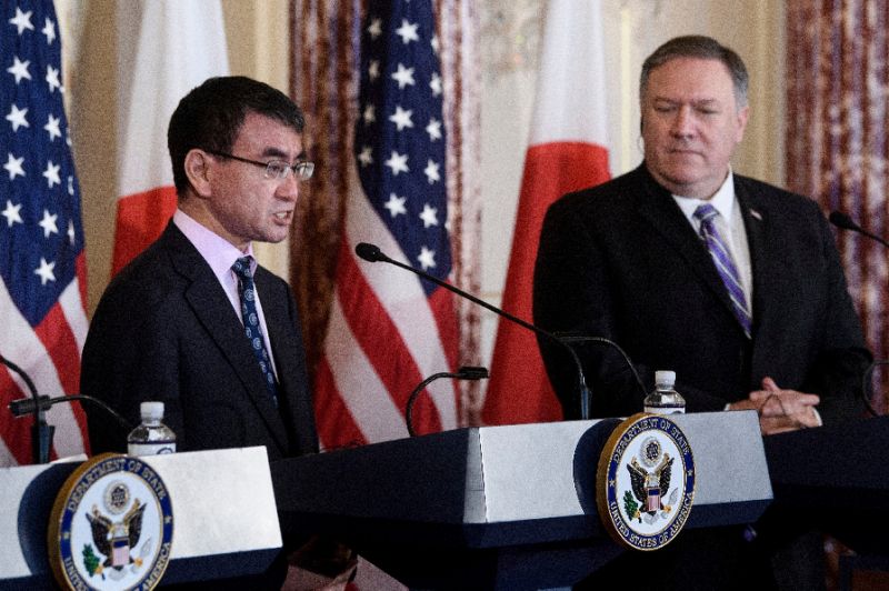 Secretary of State Mike Pompeo (right) says the United States will keep pressing Russia over election interference