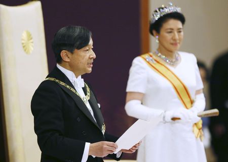 Japan's Emperor Naruhito, flanked by Empress Masako, delivers a speech during a ceremony called Sokui-go-Choken-no-gi, his first audience after the accession to the throne, at the Imperial Palace in Tokyo, May 1, 2019, in this photo released by Kyodo.  Mandatory credit Kyodo/via REUTERS