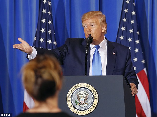 Asked by DailyMail.com whether he delivered a sterner tone on election interference to Putin in private, Trump responded: 'No. We talked about it. We talked about it.