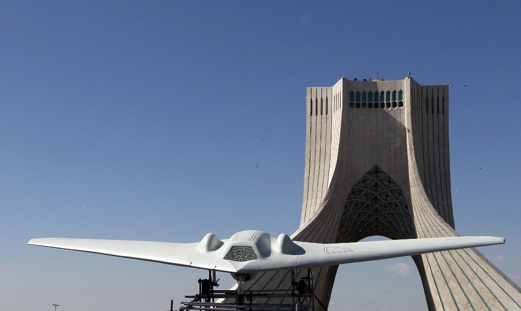 A stealthy RQ-170 Sentinel (pictured on display in Tehran) was lost over Iran in 2011, with Tehran claiming to have used it to build a copy of its own (AFP Photo/ATTA KENARE)