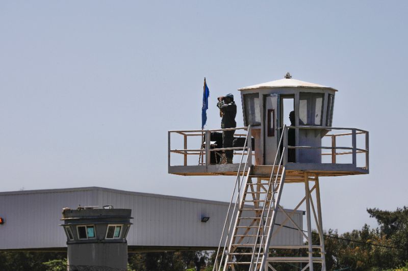 UN peacekeepers observe the Quneitra border crossing with Syria in the Israeli annexed-Golan Heights