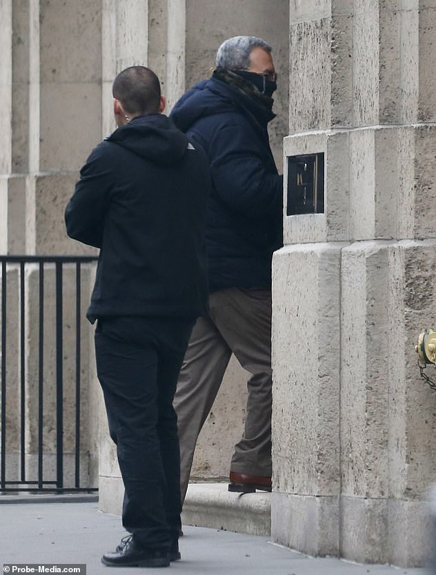 Barak, now 77, was wearing a camo-style neck gaiter which he pulled high over his face almost to his glasses when he went into the East 77th Street mansion