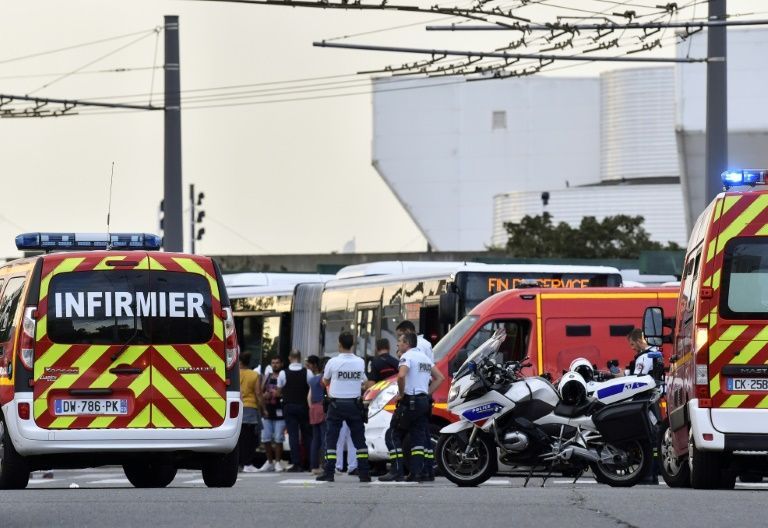 Emergency services are at work in Villeurbanne on the outskirts of Lyon, south-eastern France, after a knife attack (AFP Photo/PHILIPPE DESMAZES)