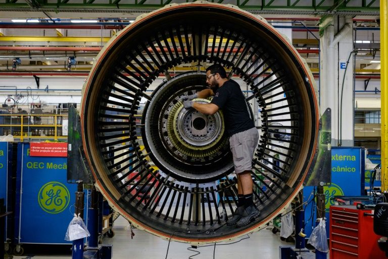 A man works with a jet engine at General Electric (GE) Celma, GE's aviation engine overhaul facility in Rio de Janeiro, Brazil