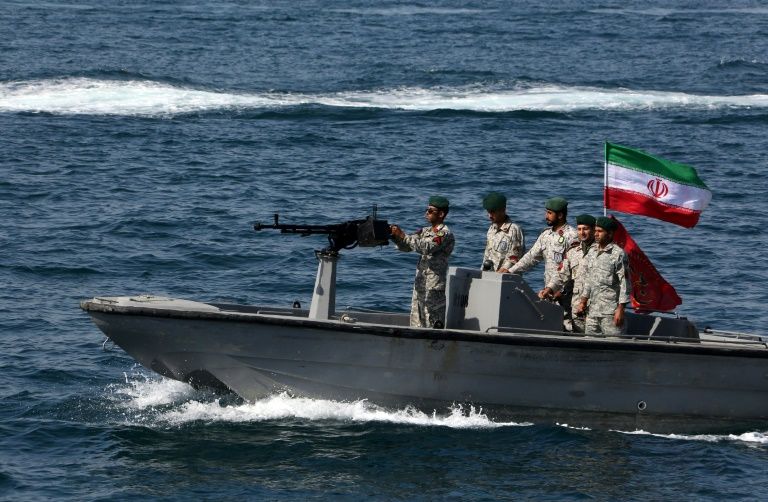 Iranian military personnel ride in a patrol boat in the Strait of Hormuz as they take part in "National Persian Gulf day" in April this year