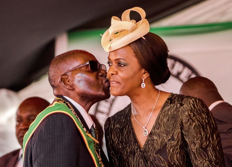 President Robert Mugabe, seen here with his wife, was in power for 37 years before his 2017 ouster (AFP Photo/Jekesai NJIKIZANA)