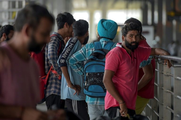 Indian nationals arrive at Indira Gandhi International airport after being deported from Mexico