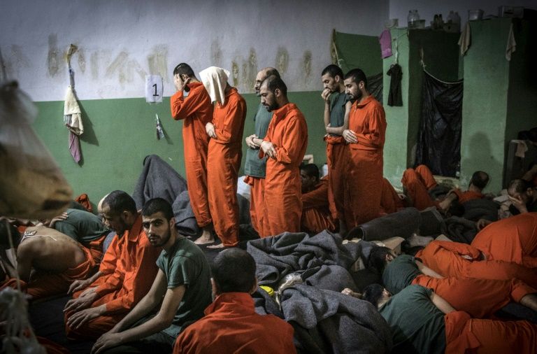 The prisoners live cheek by jowl in crowded cells with barely enough room to move (AFP Photo/FADEL SENNA)