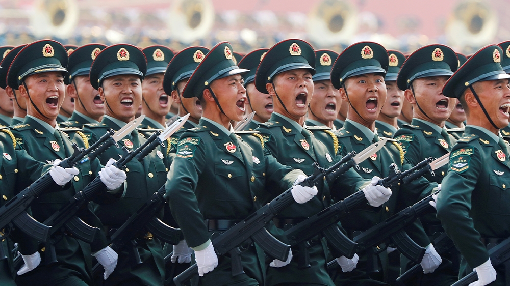 Soldiers of People's Liberation Army (PLA) march in formation during the military parade marking the 70th founding anniversary of People's Republic of China, on its National Day in Beijing, China October 1, 2019. REUTERS/Thomas Peter China 70 soldiers