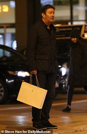 After setting up his sleek new computer, he headed home holding his bag