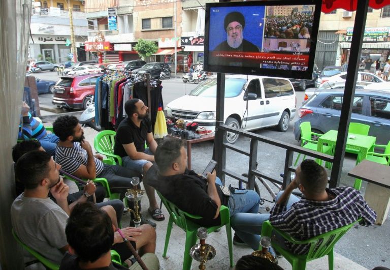 Hezbollah supporters watch a televised speech by Hassan Nasrallah in Beirut late last month; the leader of the powerful Iran-backed Shiite movement has warned demonstrations in Lebanon could lead to 