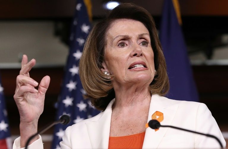Nancy Pelosi is seen answering questions on June 2, 2017 after US President Donald Trump announced plans to withdraw from the Paris climate accord; the House speaker will lead a delegation to Madrid for follow-up climate talks
