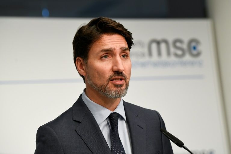 Canada's Prime Minister Justin Trudeau, pictured February 14, 2020, has asked Canadians to avoid all but essential foreign travel
