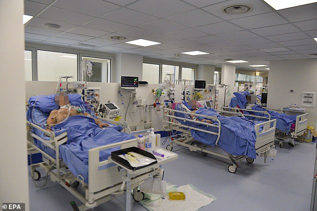 COVID-19 patients in the intensive care unit in Brescia, Italy on Monday. President Trump said he told Italy's prime minister he would send him $100 million in medical supplies