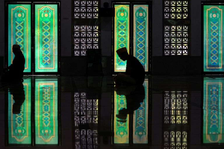 Some people still took part in Friday prayers at this mosque in Banda Aceh in Indonesia but attendance was lower than usual (AFP Photo/CHAIDEER MAHYUDDIN)