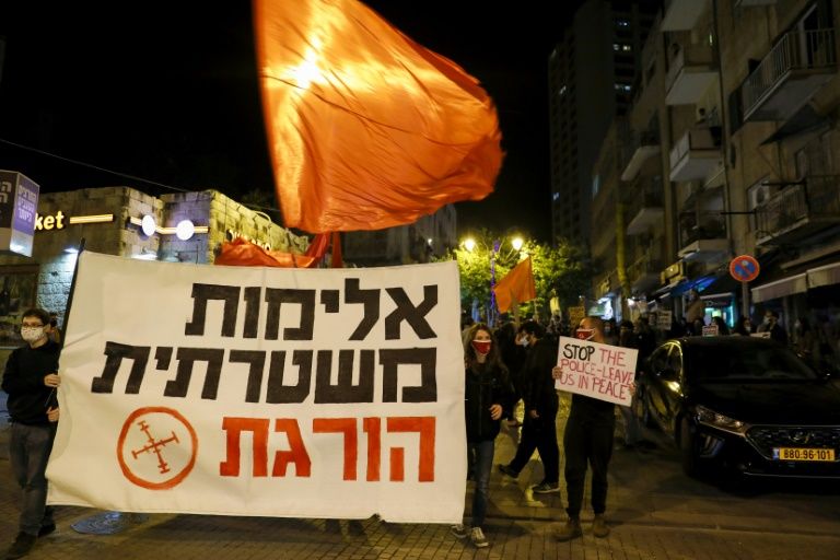 Around 200 Israelis took part in a protest outside police headquarters in Jerusalem to denounce the killing of Palestinian Iyad Khairi Hallak (AFP Photo/Ahmad GHARABLI)