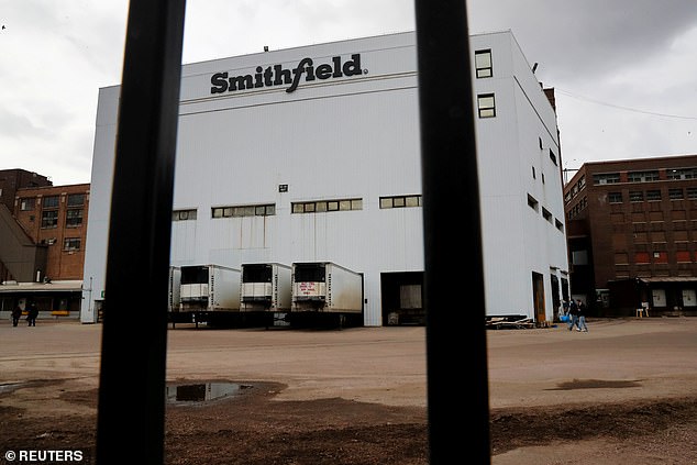The above image shows a Smithfield Foods pork plant in Sioux Falls, South Dakota, on April 16. The plant, which was shuttered for three weeks after hundreds of employees became infected with COVID-19, reopened this week, though more COVID-19 cases have been reported