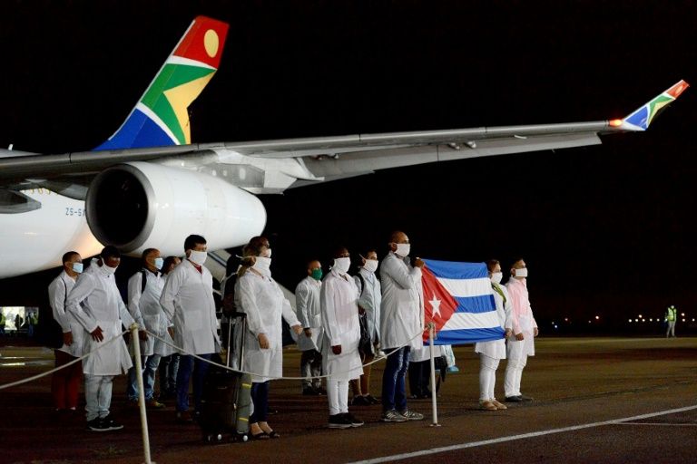Cuban medical workers arrive at the Waterkloof Air Force Base in Pretoria in an effort to fight the coronavirus, in a photo released by the South African government on April 27