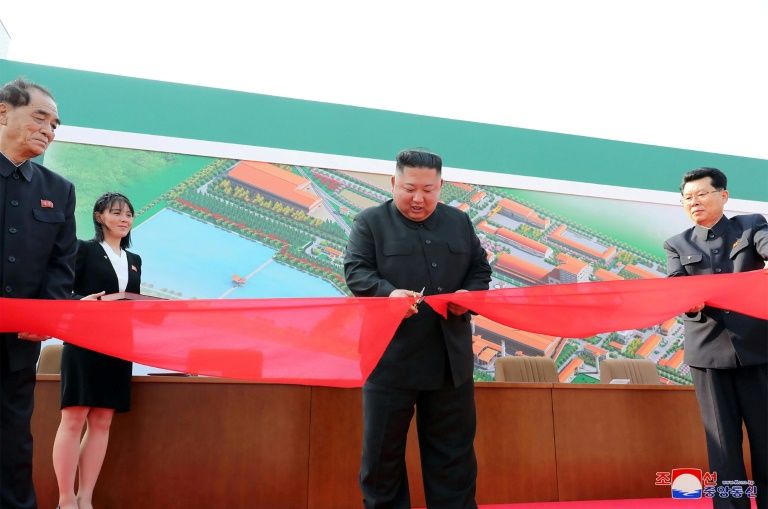 North Korea said the picture taken on May 1, showed North Korean leader Kim Jong Un (2nd R) attending a ceremony in South Pyongan Province (AFP Photo/STR)
