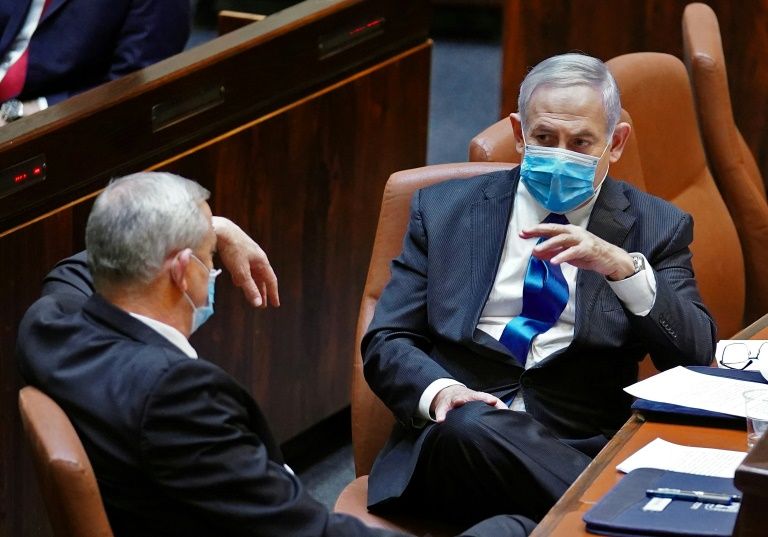 Netanyahu, whose trial was delayed because of the coronavirus pandemic, says the accusations of corruption against him are part of a witch hunt by the media and legal officials (AFP Photo/Adina Valman)
