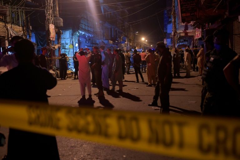 Pakistani security personnel gather at the site of a bomb in the city of Rawalpindi that killed one person and wounded ten (AFP Photo/Farooq NAEEM)