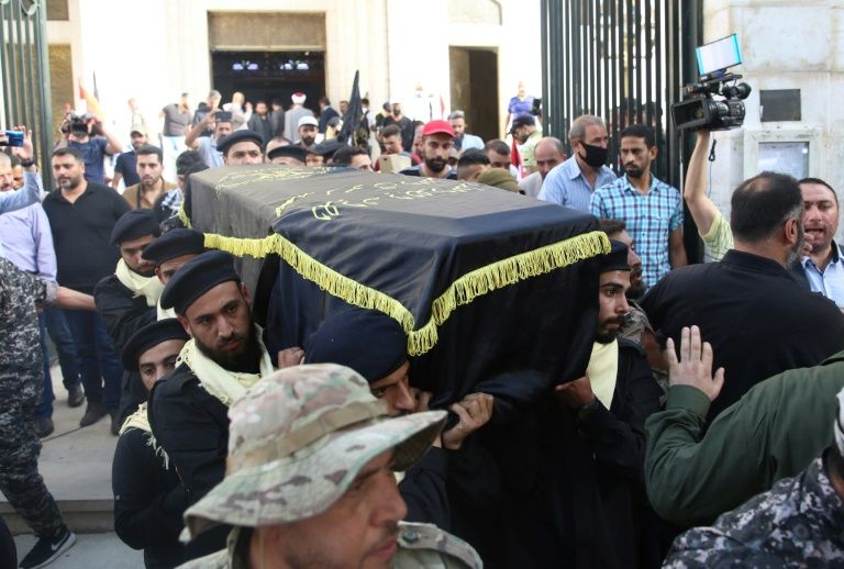 Mourners carry the coffin of Shalah during his funeral in the Syrian capital Damascus on June 7, 2020 (AFP Photo/STR)