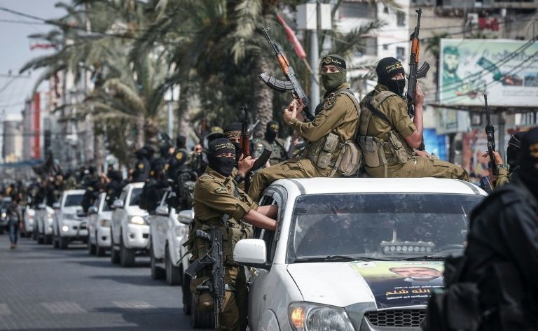Members of the Palestinian Islamic Jihad militant group take part in a symbolic funeral for the movement's former leader Ramadan Shalah in Gaza city on June 7 (AFP Photo/MAHMUD HAMS)