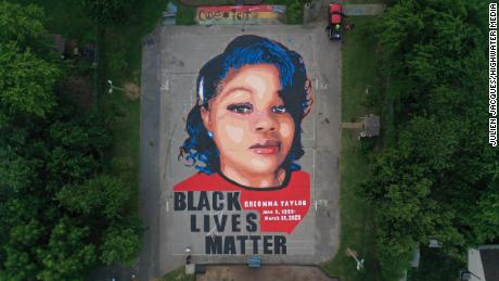 Artists and volunteers painted a 7,000-square-foot mural of Breonna Taylor Over the Fourth of July weekend