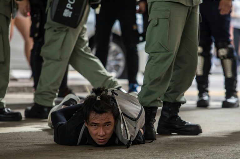 Police have arrested more than 9,000 people during the past year of unrest (AFP Photo/DALE DE LA REY)
