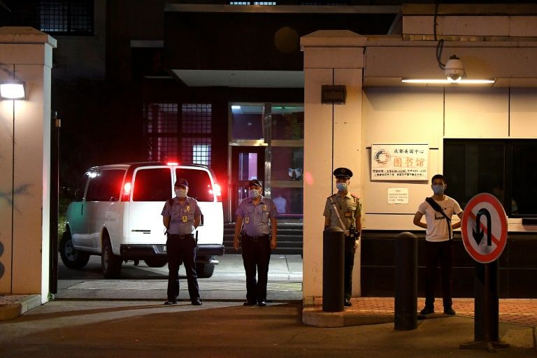 A car enters the US Consulate in Chengdu overnight ahead of its closure on Monday morning (AFP Photo/Noel Celis)