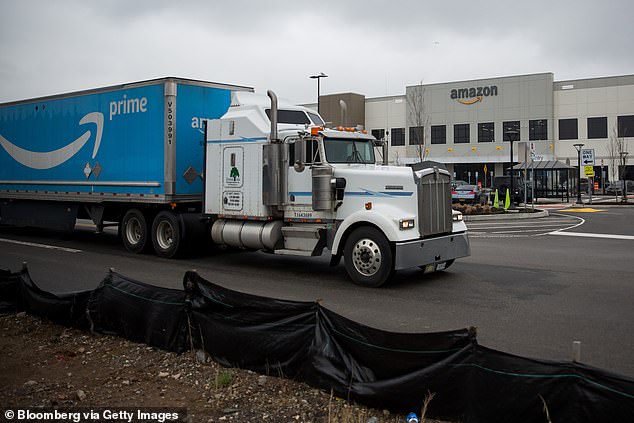 A truck passes an Amazon warehouse on Staten Island in a file photo. A California appeals court has found that the online retail giant can be held liable for defective goods sold by third-party vendors through its marketplace